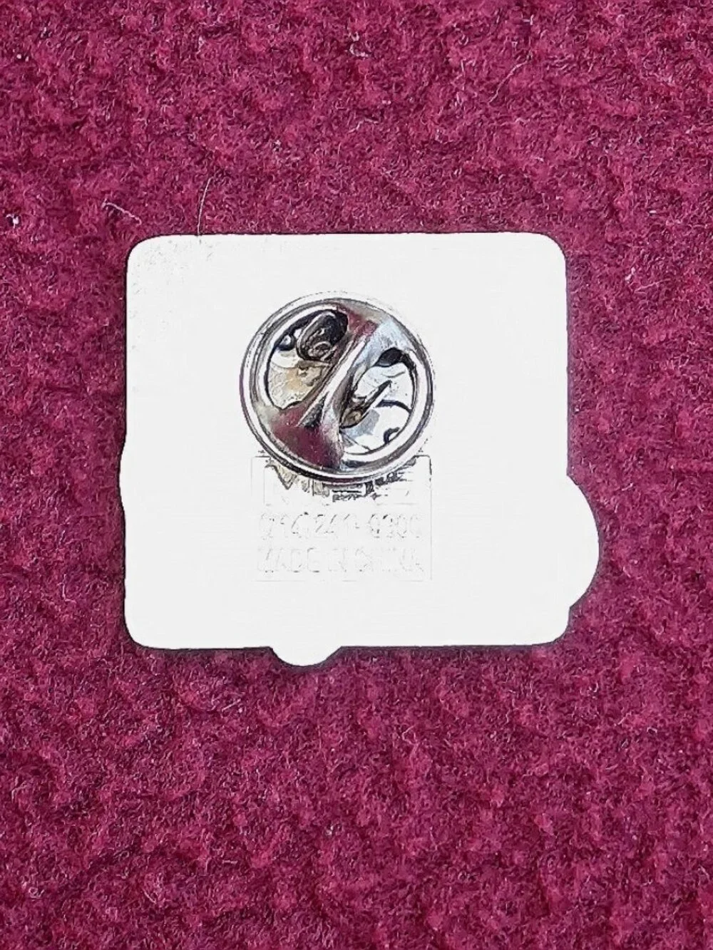 The product is a new 2007 Edelbrock hot rod hat or vest pin.